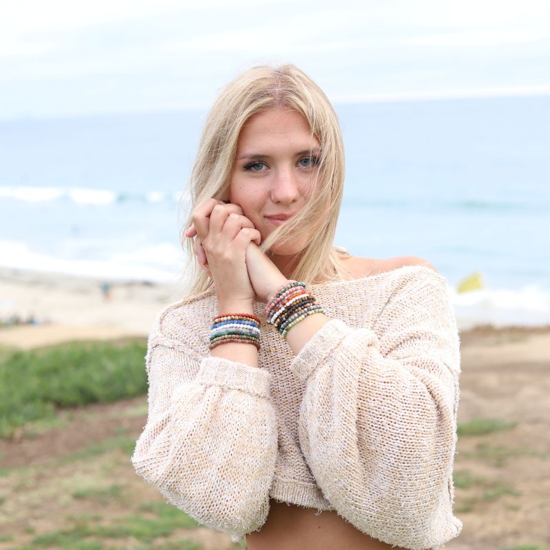 Woman wearing dainty Fluorite Amethyst and Aventurine bracelet set