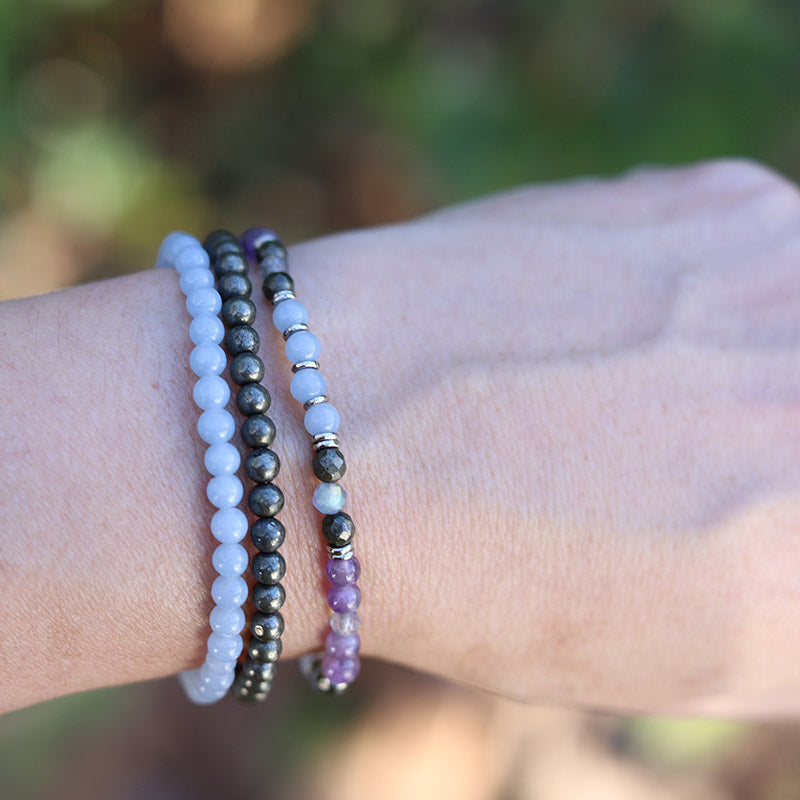 Model wearing Angelite and Amethyst Delicate Bracelet Set