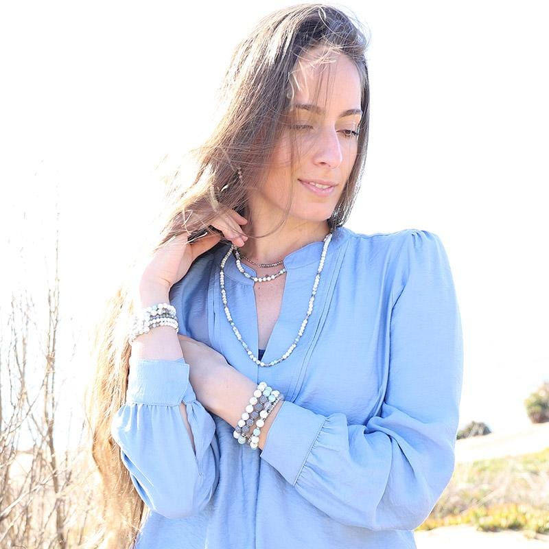 Woman wearing dainty Howlite Amazonite and Labradorite bracelet