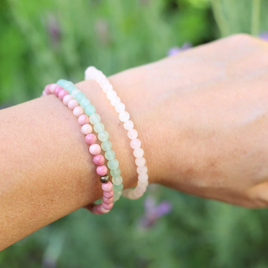 Woman wearing dainty Rose Quartz Aventurine & Rhodonite bracelet