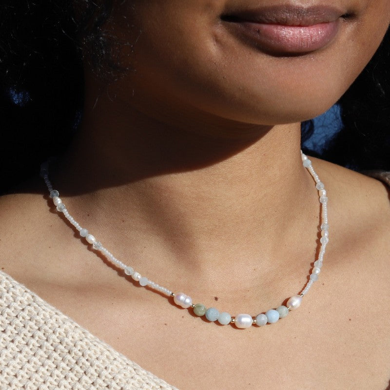 Woman wearing Aquamarine and Pearls Necklace