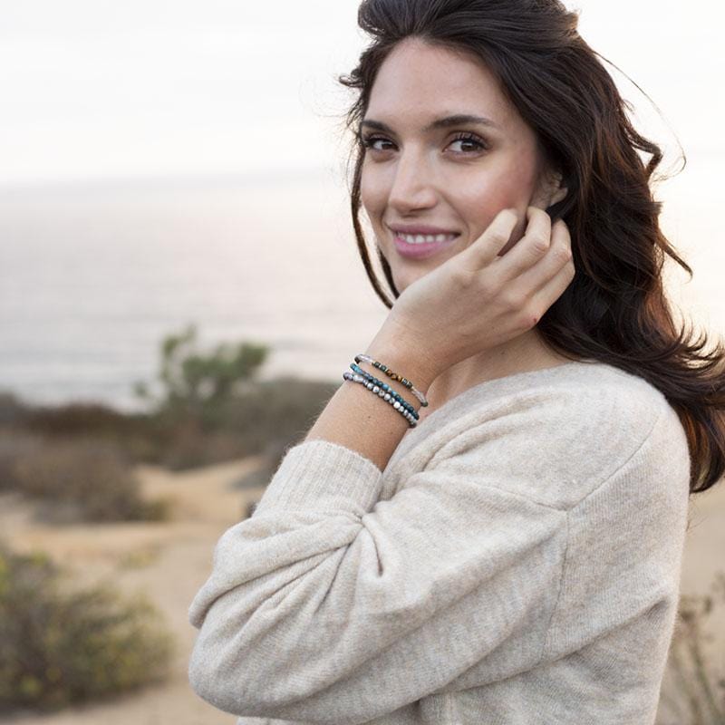 Woman wearing dainty Apatite, Tigers Eye and Jasper bracelet