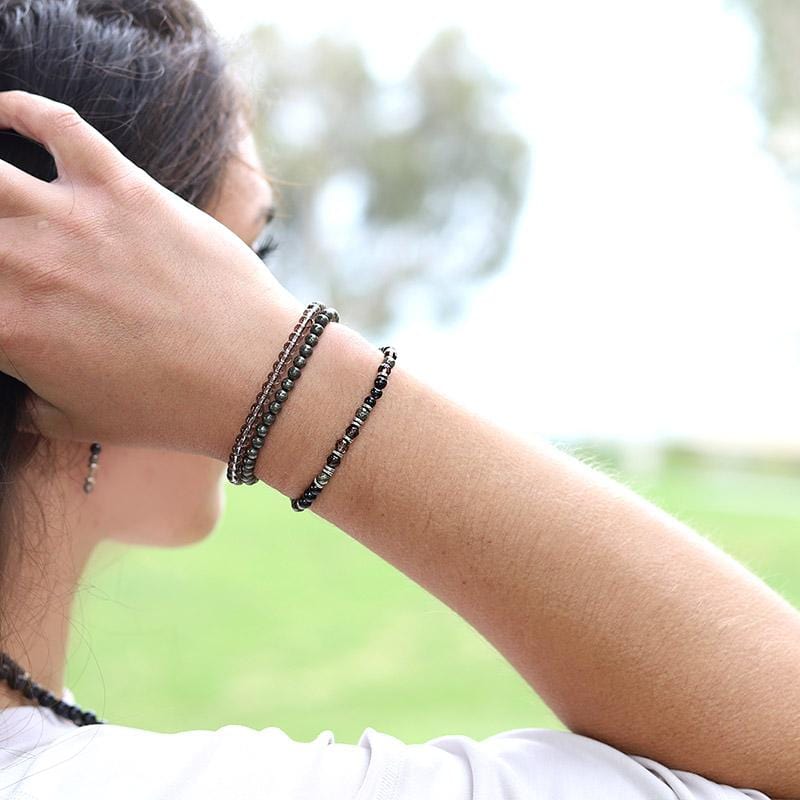 Woman wearing dainty Black Tourmaline and Smoky Quartz Bracelet Set
