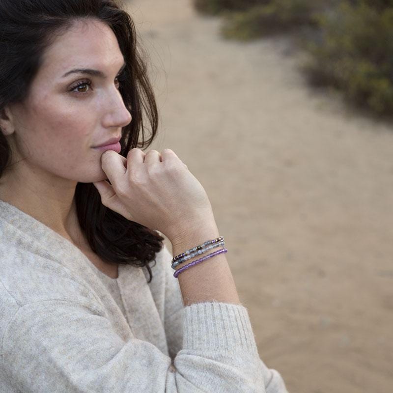 Woman wearing dainty Cloudy Quartz and Amethyst Delicate Bracelet Set