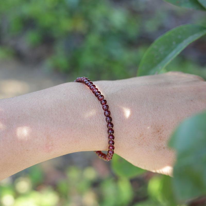 Woman wearing dainty Garnet bracelet