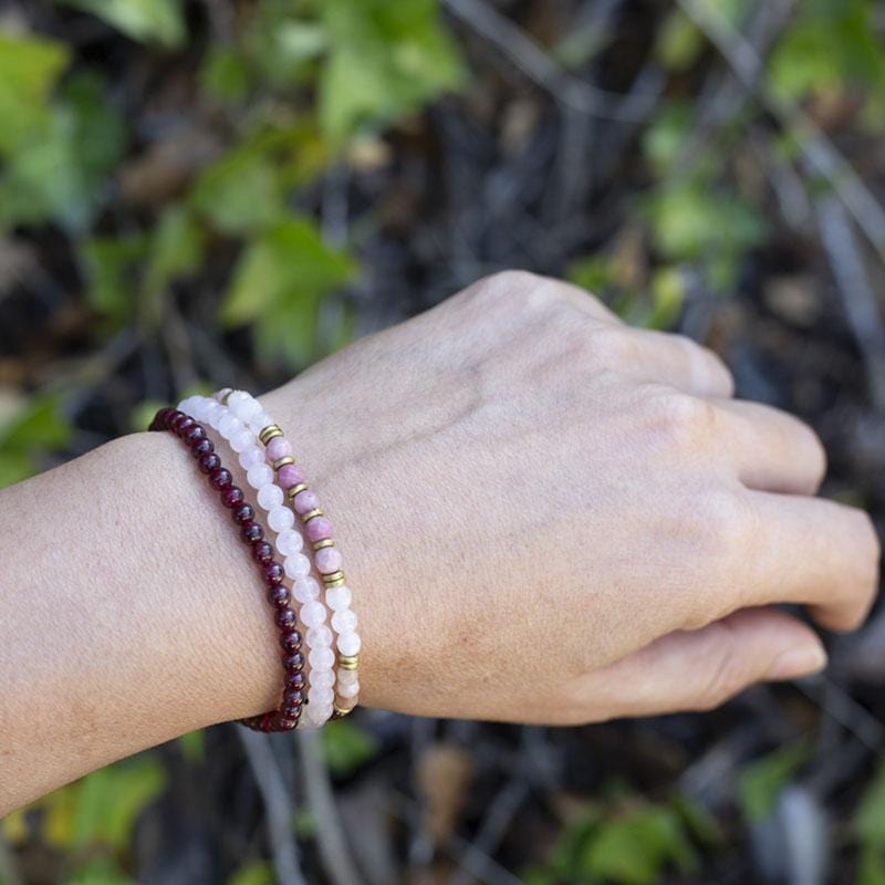 Garnet and Rose Quartz Dainty Bracelet Stack on hand model