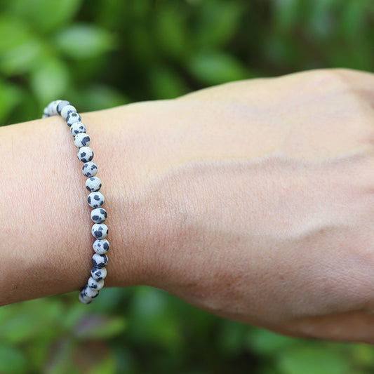 Matte Dalmatian Jasper Bracelet on hand model