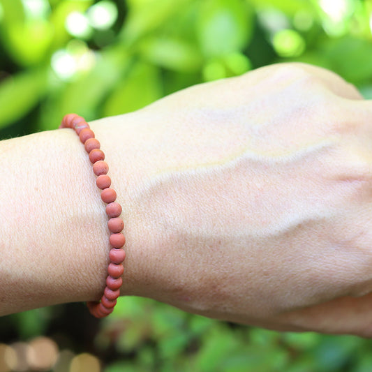 Matte Red Jasper Bracelet on hand model