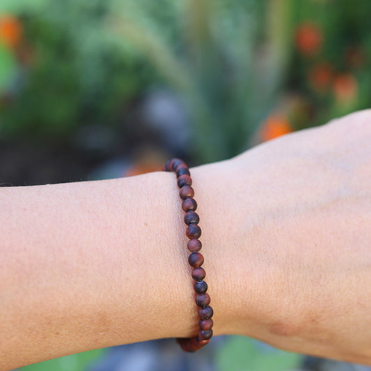 Matte Red Tiger's eye Bracelet on hand model