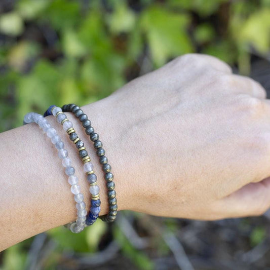 Woman wearing dainty  Sodalite Quartz Crystal and Pyrite bracelet set