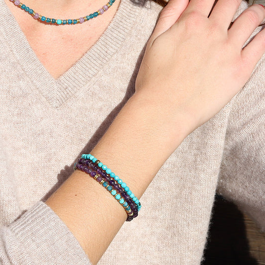 Woman wearing dainty Amethyst and Apatite bracelet set